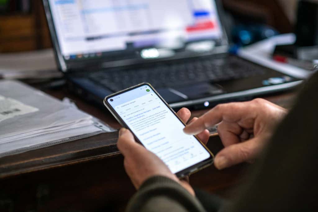 A close up of someone using a smart phone.