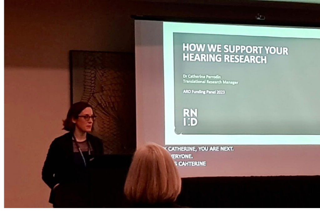 Picture of Dr Catherine Perrodin, our Translational Research Manager, giving a talk about how we support hearing research