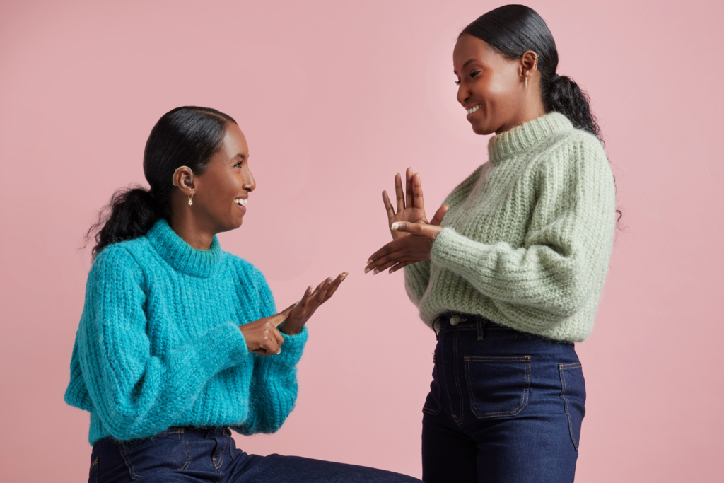 Two women using British Sign Language
