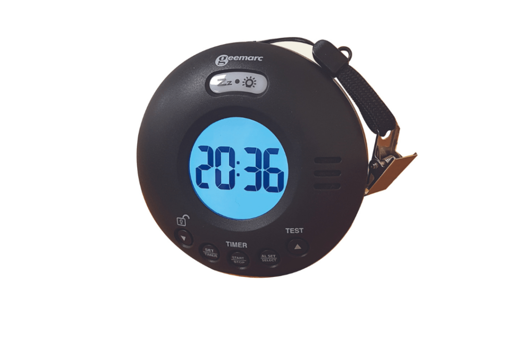 A circular clip on black plastic clock with a lit-up digital number face.