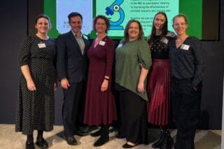 Staff from RNID and the BIA standing together. Left to right, Sinead Donoghue (RNID), Steve Bates (BIA), Harriet Oppenheimer (RNID), Laura Bunn (RNID), Alina O'Keeffe (BIA), Jane Wall (BIA).