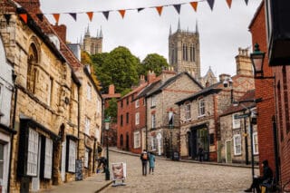 A traditional market town with a cathedral in the background