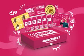 An RNID Connect pack: a pink box with #RNID Connect written on it. Illustrations of hearts, music icons and swirls emit from the box.